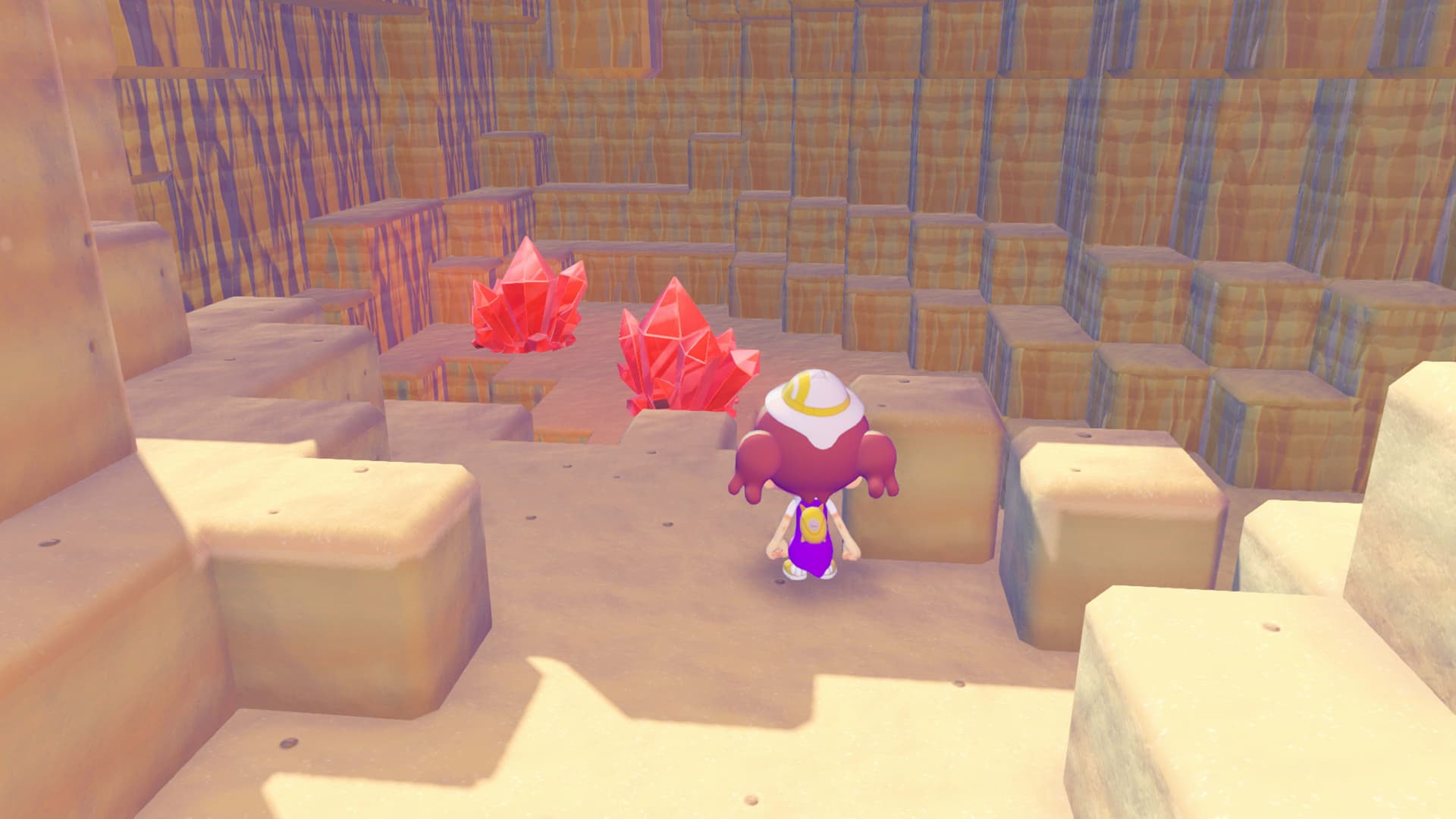《Pokémon Pokopia》官方画面:勾魂眼水晶探宝期间在梦境岛洞穴收集红色水晶碎片。